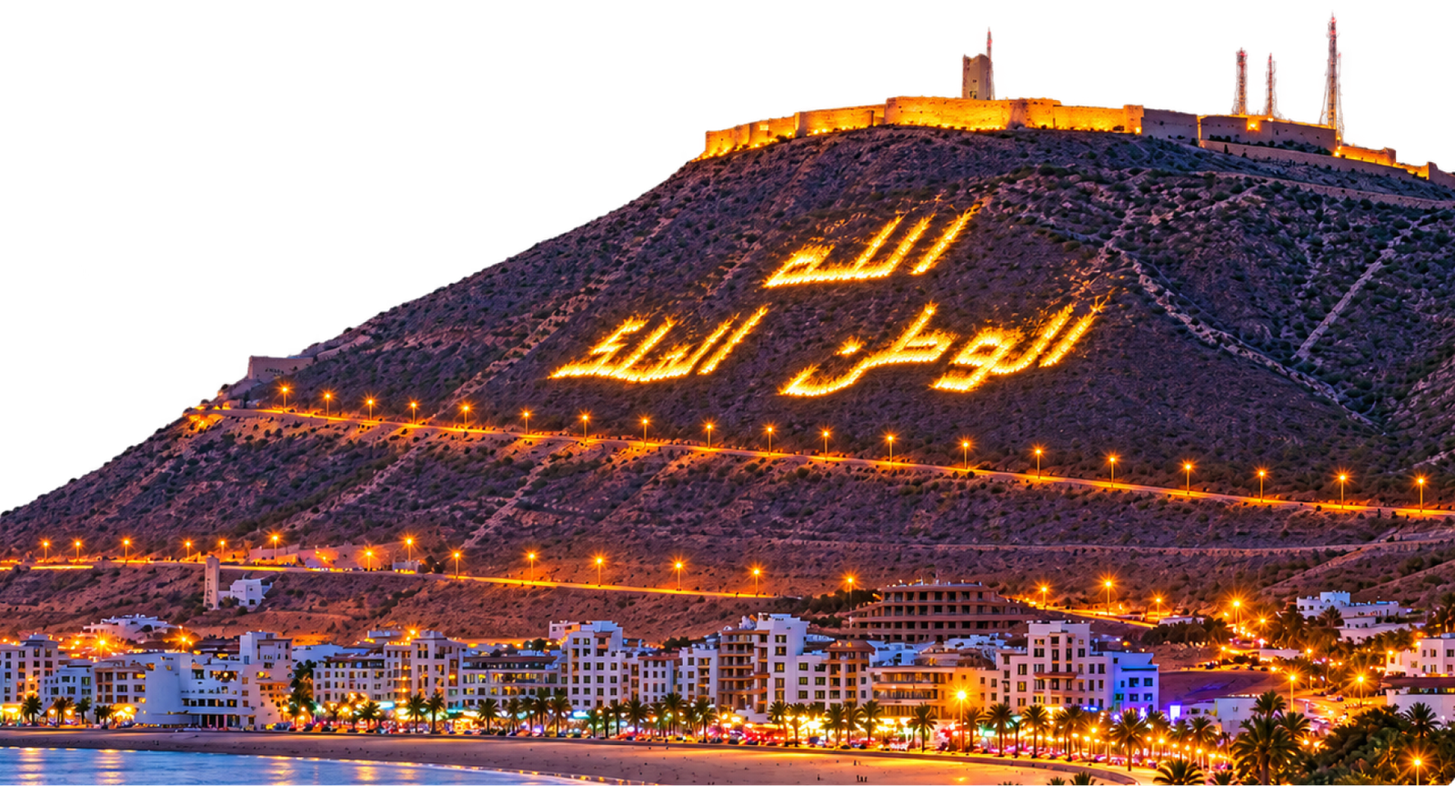 Agadir bay at night with the illuminated Kasbah hillside above the seafront